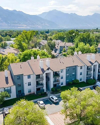 Charming apartment complex nestled in lush greenery with stunning mountain views in Millcreek Utah