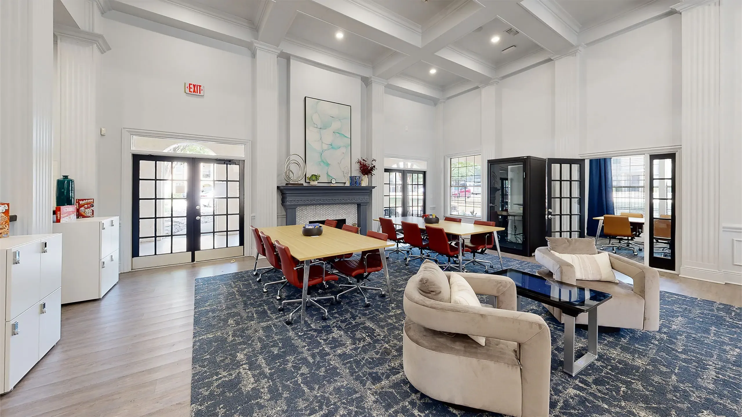 Elegant co-working space with high ceilings, plush seating, and modern decor, perfect for productivity and collaboration at Stonebriar at Frisco Apartments