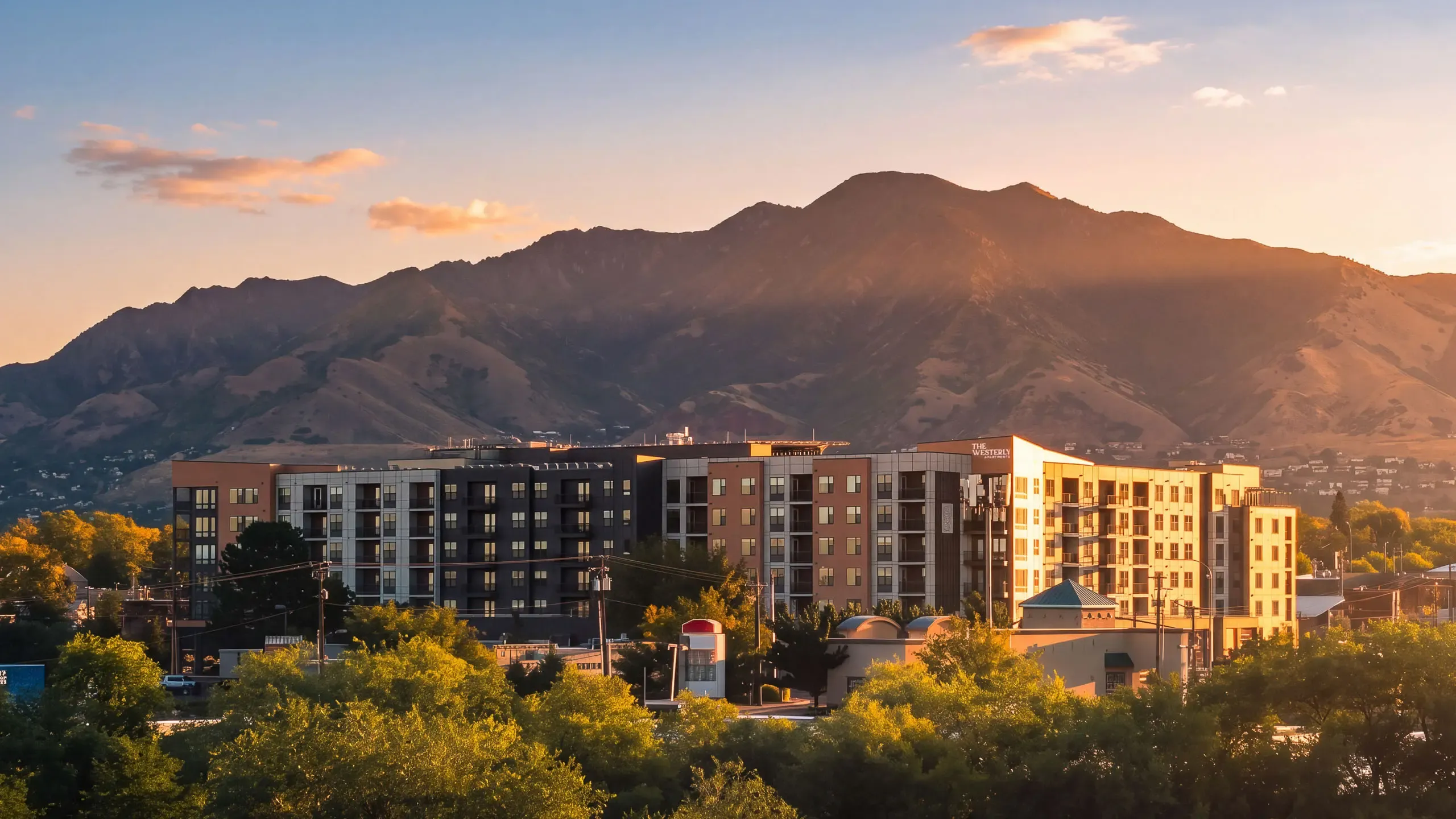 Aerial view of The Westerly Apartments with Wasatch Mountains in the background.