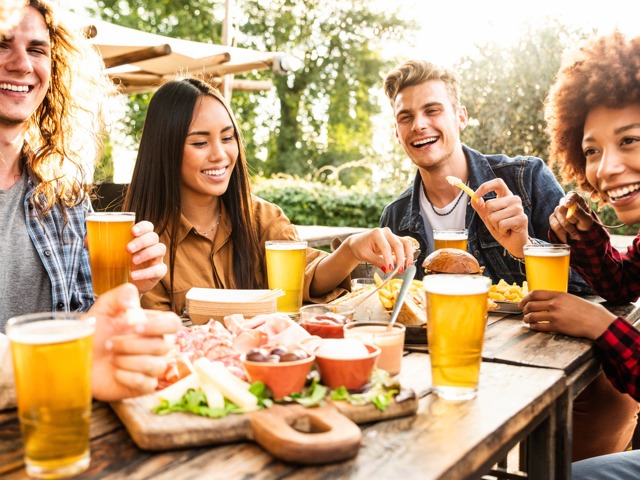 friends having beer together outside amavi celina single family homes for rent in texas