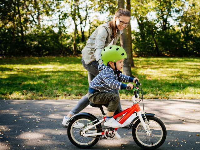 mother and son learning to ride bike in park amavi mooresville single family homes for rent in nc