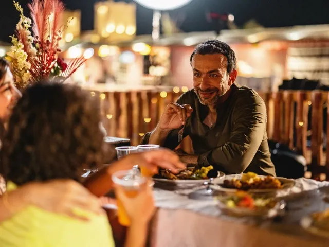friends at dinner outside at night modera st petersburg apartment homes for rent in florida