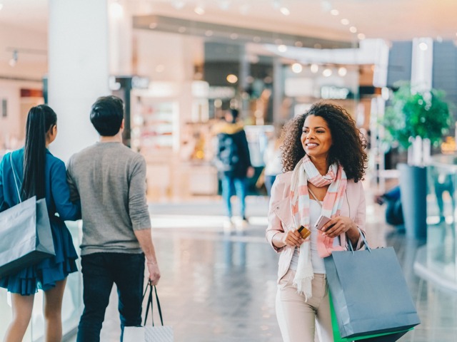 people shopping in mall with bags modera raleigh hills apartment homes for rent in or