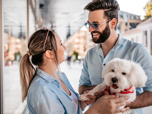 people holding dog smiling together amavi kissimmee single family homes for rent in orlando fl