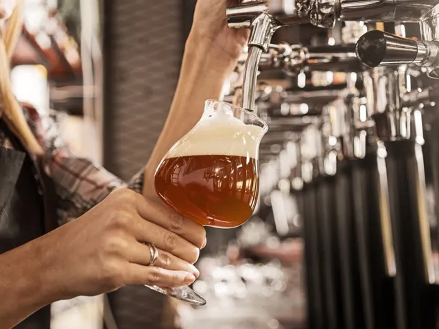 beer being poured from tap modera mckinney ridge apartment homes for rent in tx