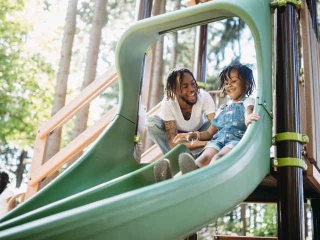 kid going down slide at playground beckett west fork apartment homes for rent in conroe tx