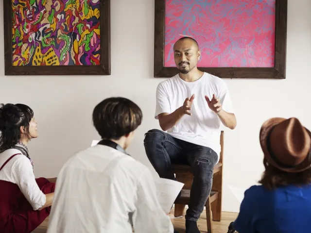 man explaining art to students modera newton apartment homes for rent in ma