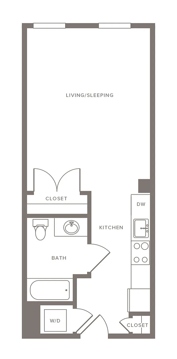Modern studio apartment floor plan showcasing open living and sleeping area, stylish kitchen, and convenient bath.