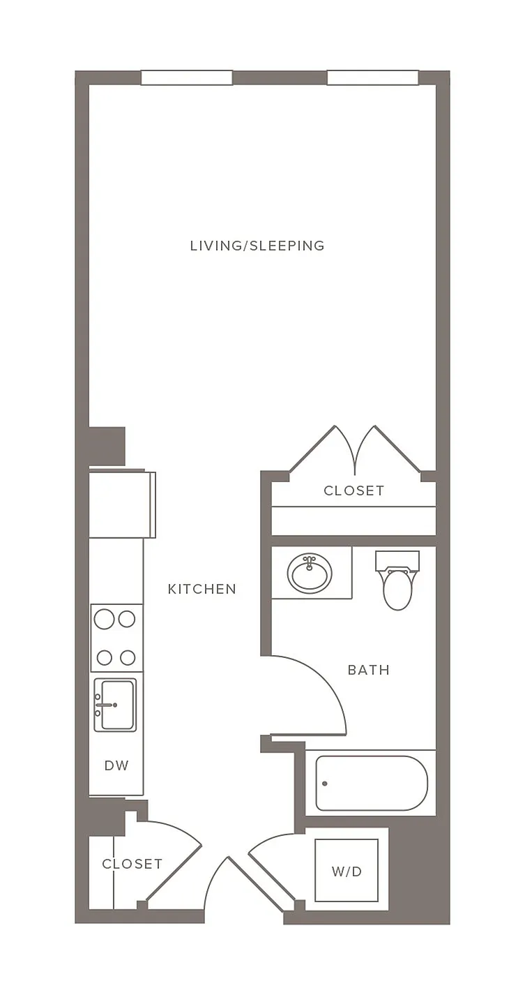 Chic studio floor plan showcasing an open-concept living/sleeping area, modern kitchen, and bathroom with ample closet space.