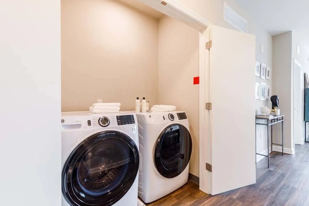 Washer and dryer side by side near kitchen