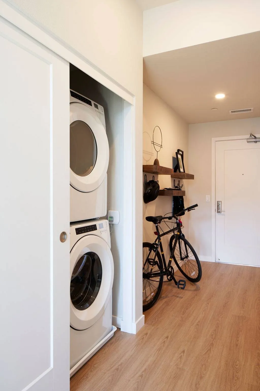 Washer and dryer in closet near entry
