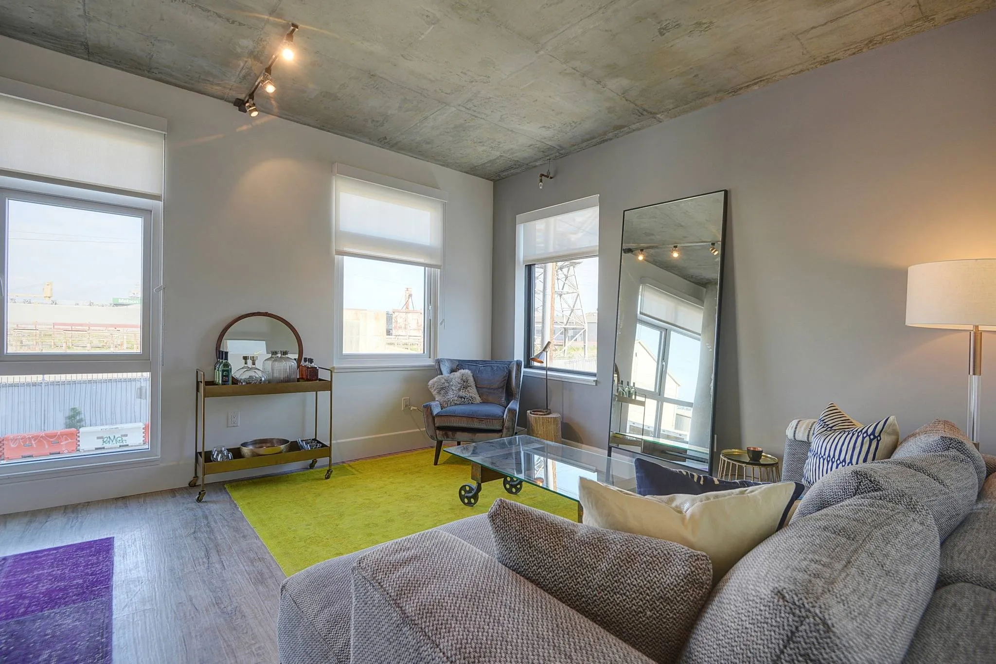 Furnished living room with wood plank style flooring