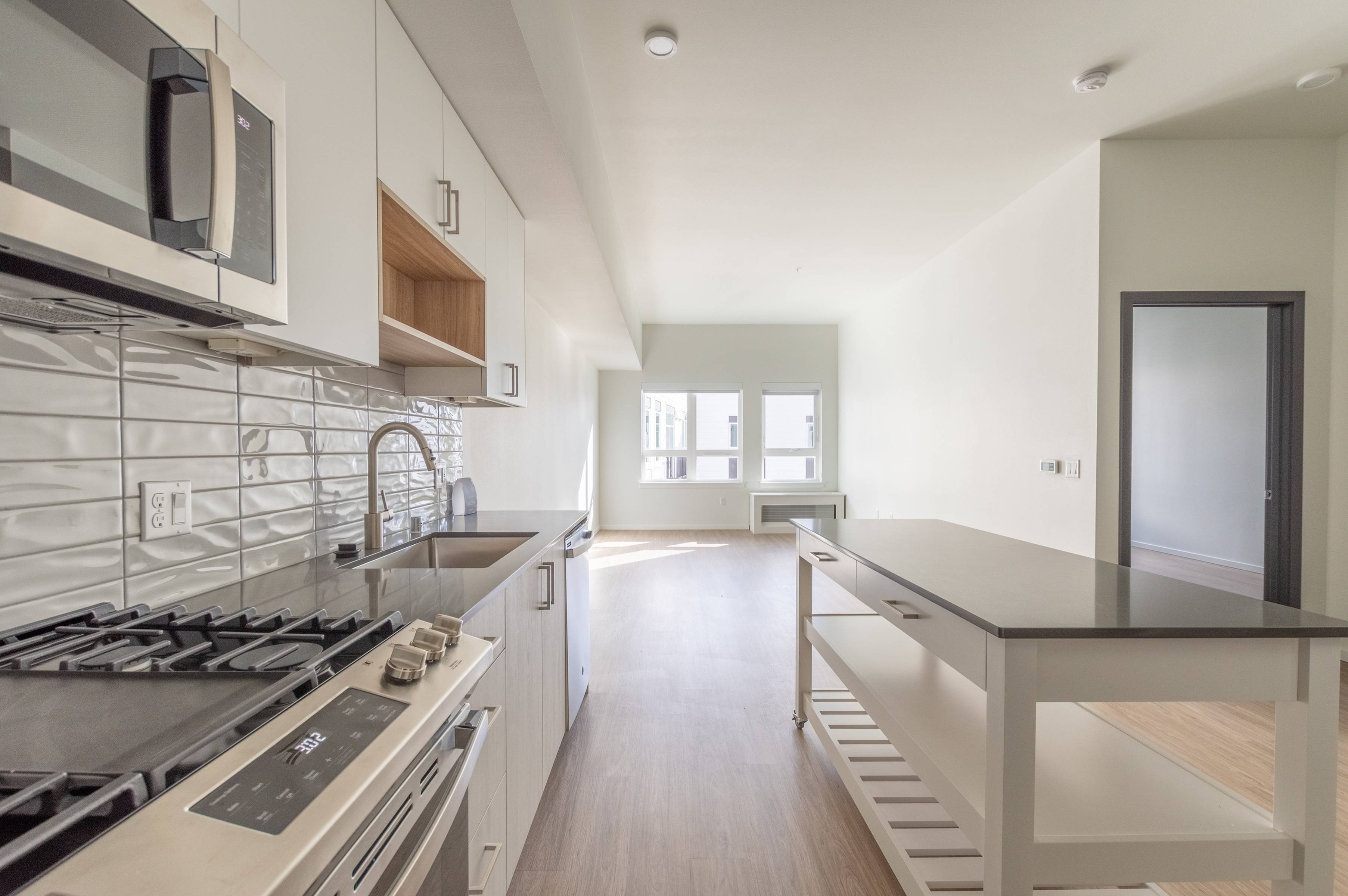 Single basin sink with storage above and large kitchen island