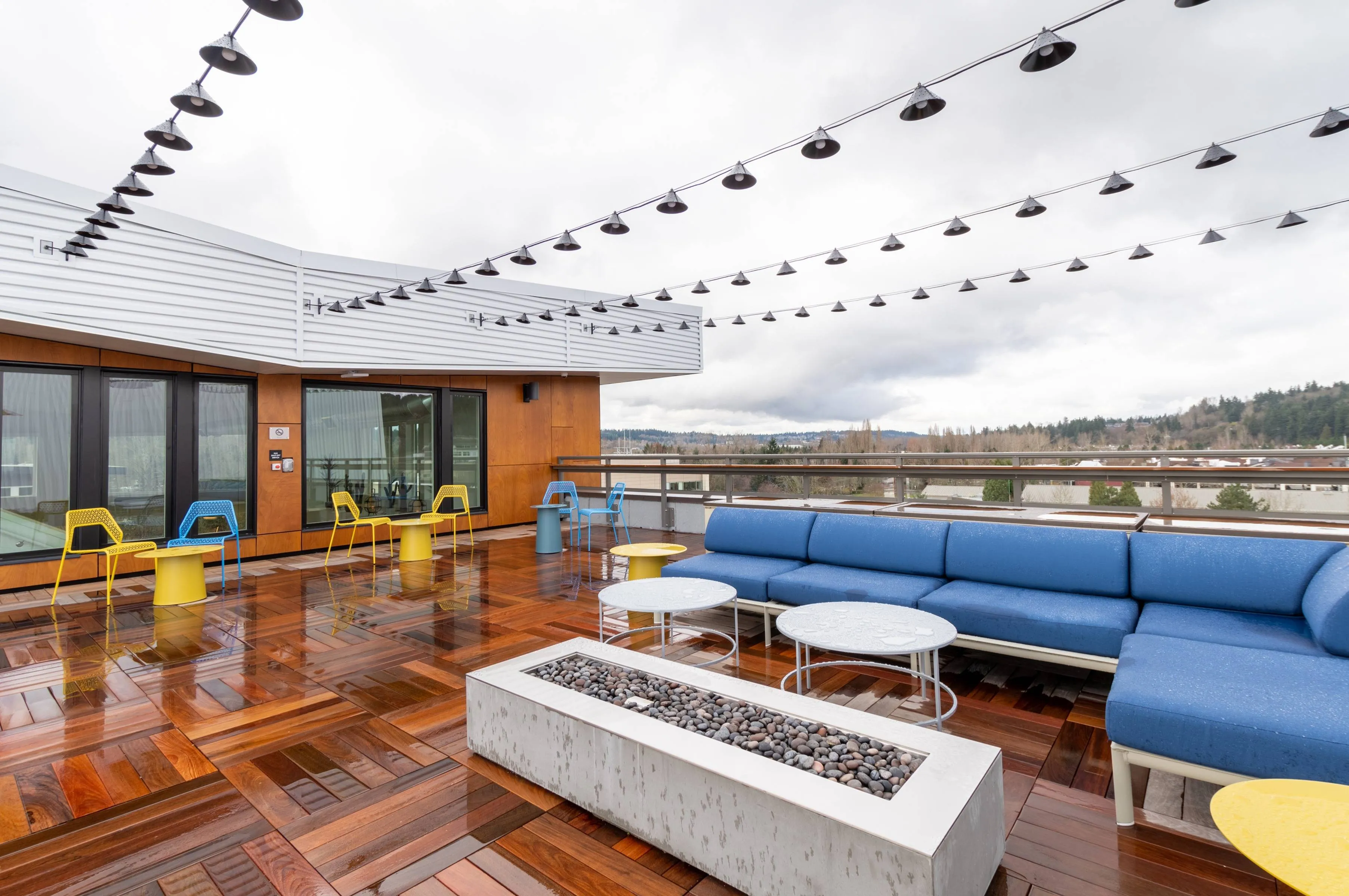 Rooftop with fire pit and dining tables