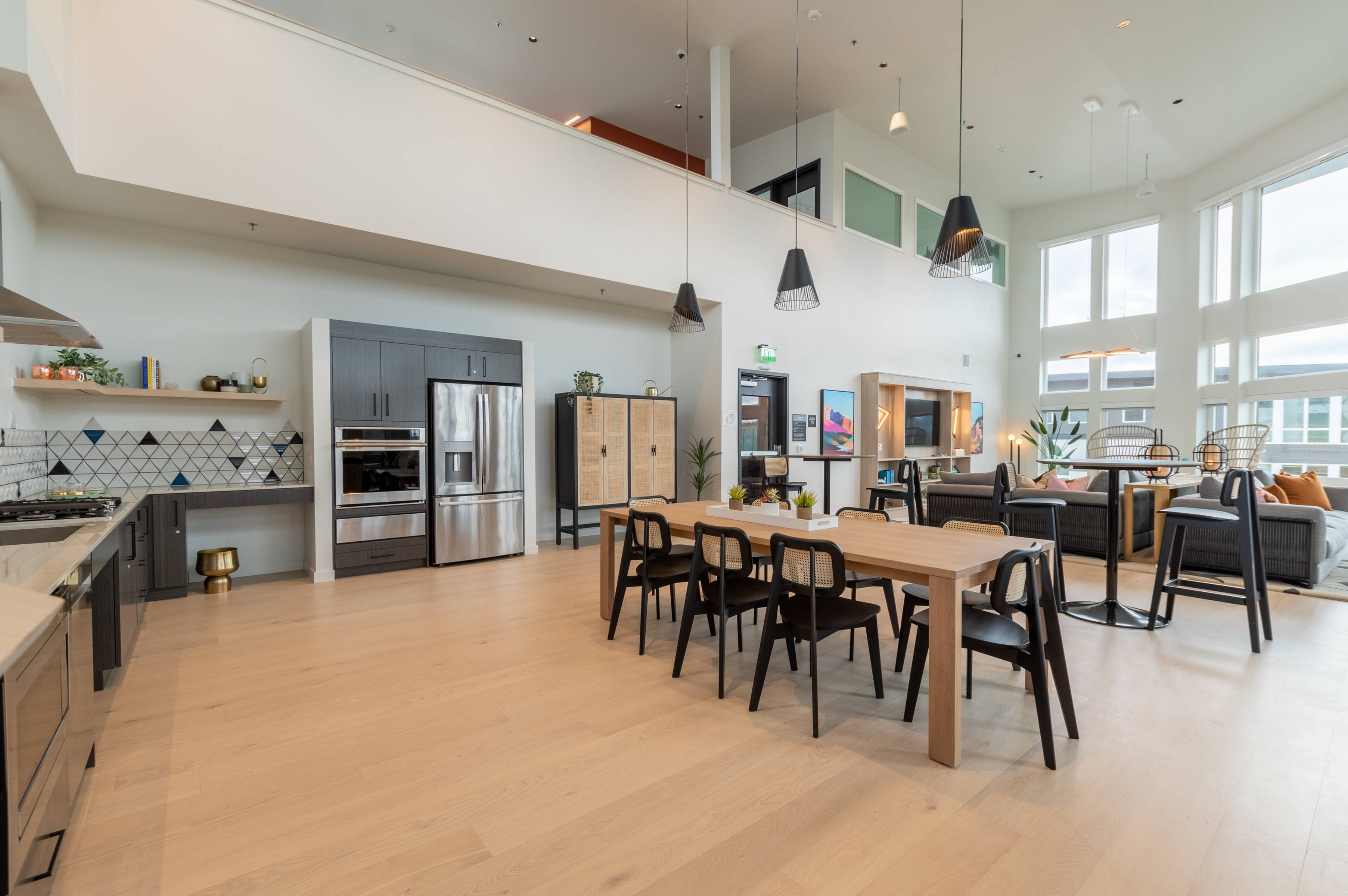 Work from home space with multiple tables, kitchen area and lounge in Sky Lounge