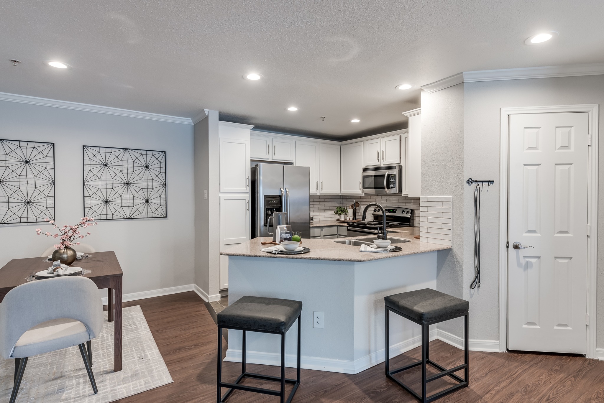 Kitchen with island seating and high-end appliances at Alister Galleria apartments houston texas