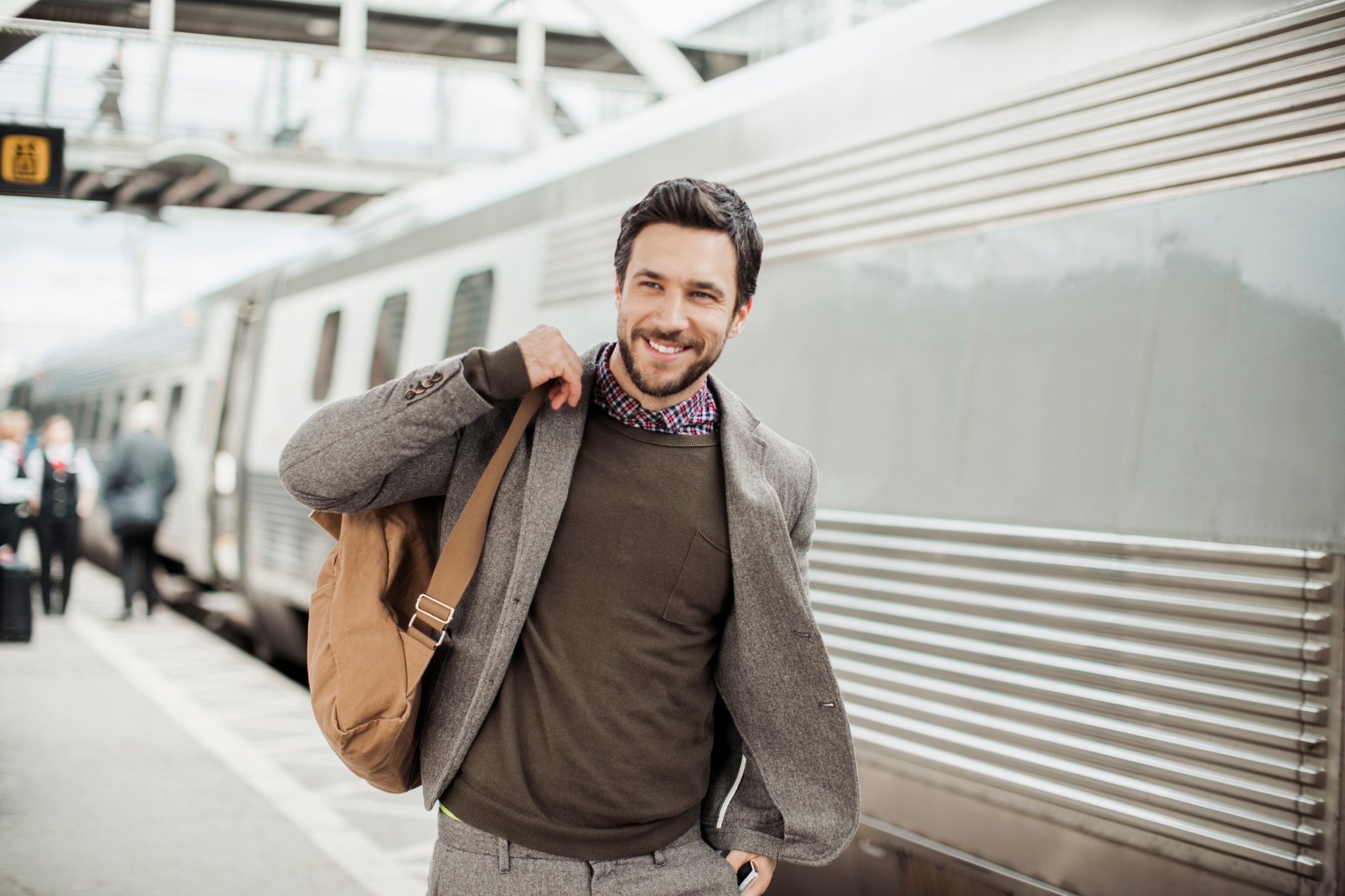 man commuting on train modera berkeley heights apartments new jersey