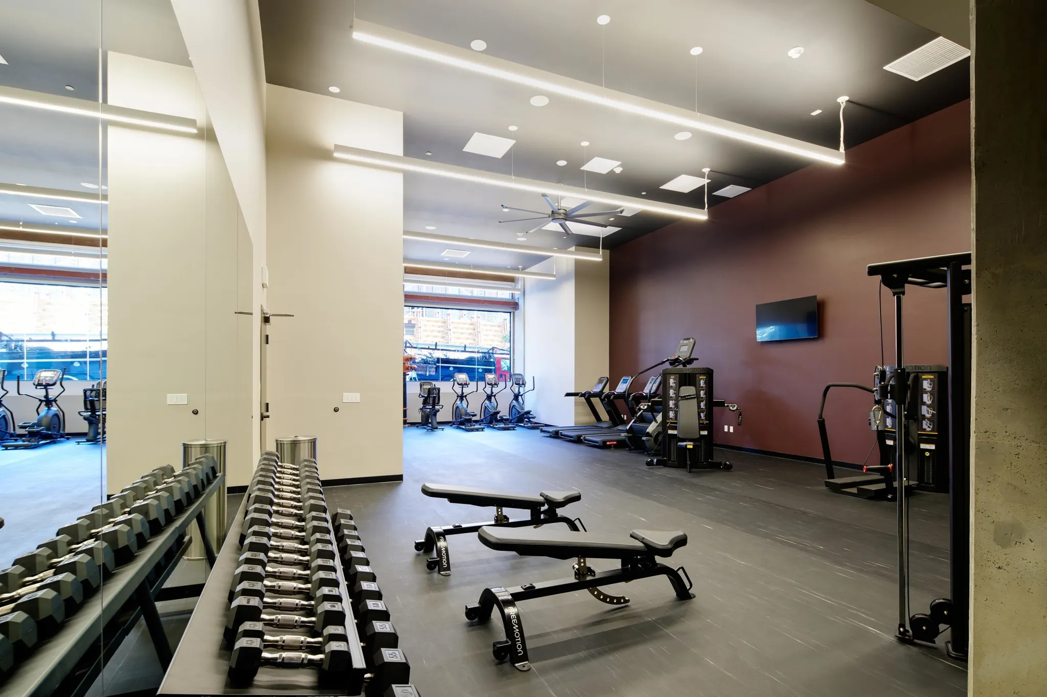 high-end gym with plenty of equipment at modera berkeley apartments california