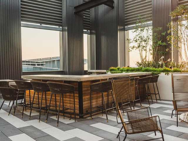 Rooftop outdoor lounge with wine bar and demo kitchen