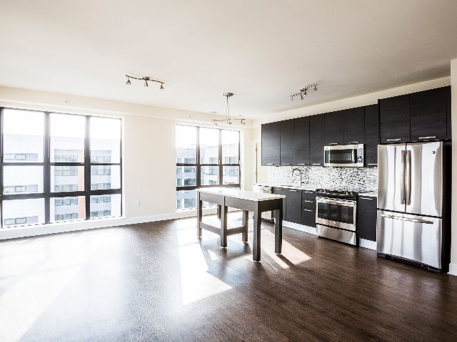 Large open floor plan with wood flooring throughout