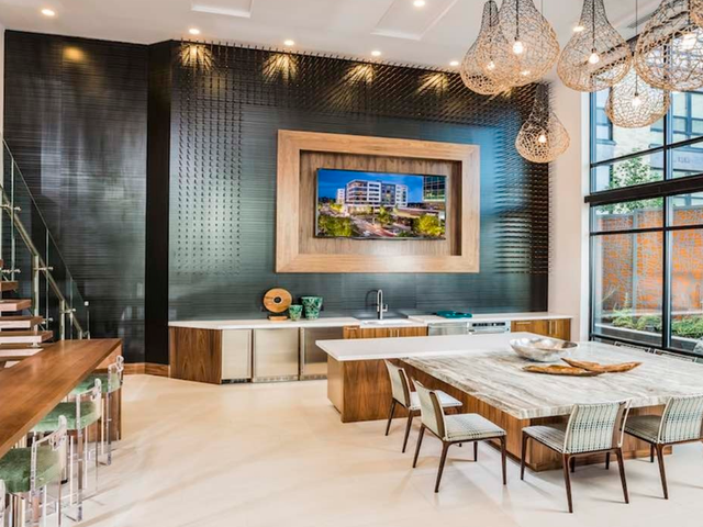 Resident lounge with large countertop seating and kitchen