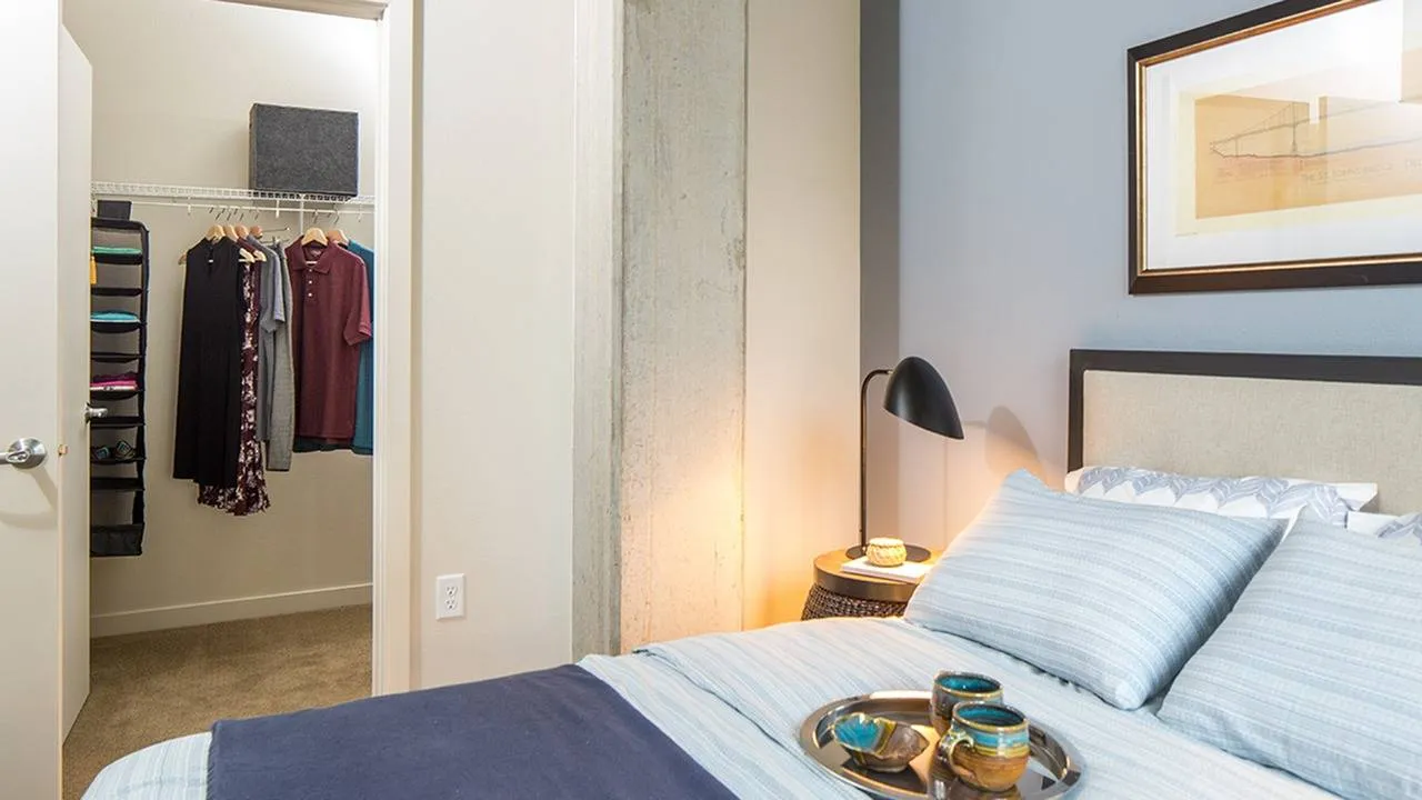 Exposed concrete pillar in bedroom