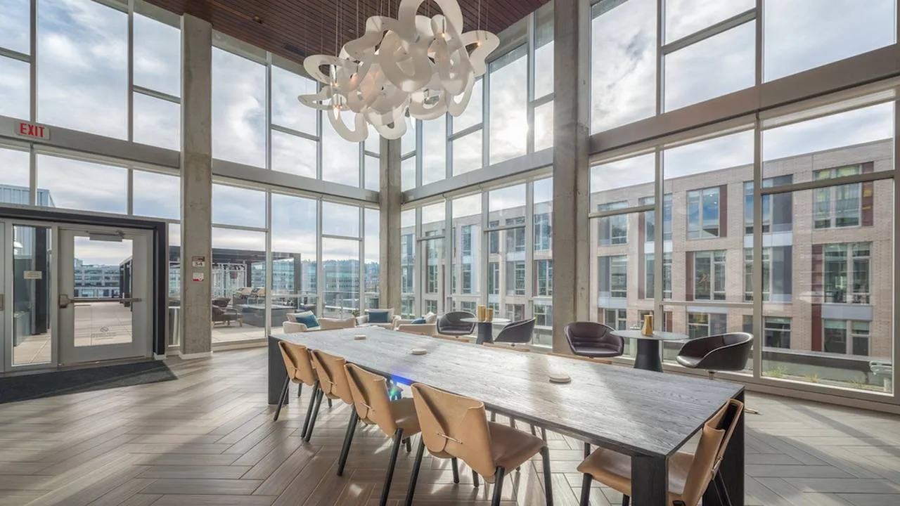 8th floor resident lounge with floor to ceiling windows