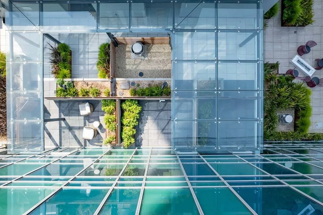Penthouse home terrrace space below glass overhangs