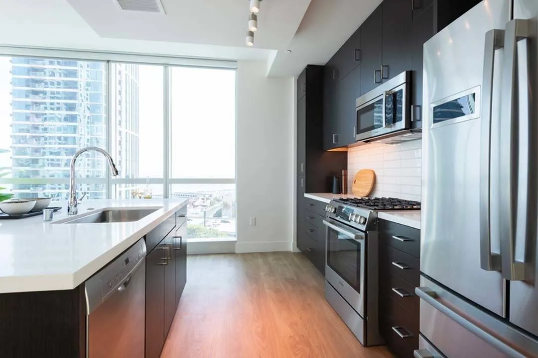 Double-door refrigerators and concrete accent walls in some homes*