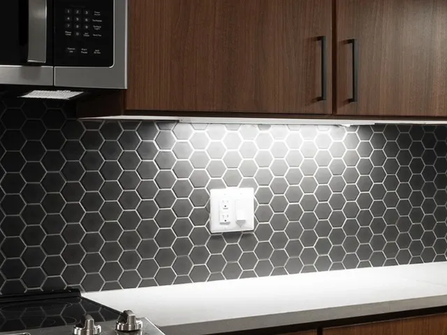 Undercabinet lighting close up in the kitchen below the microwave