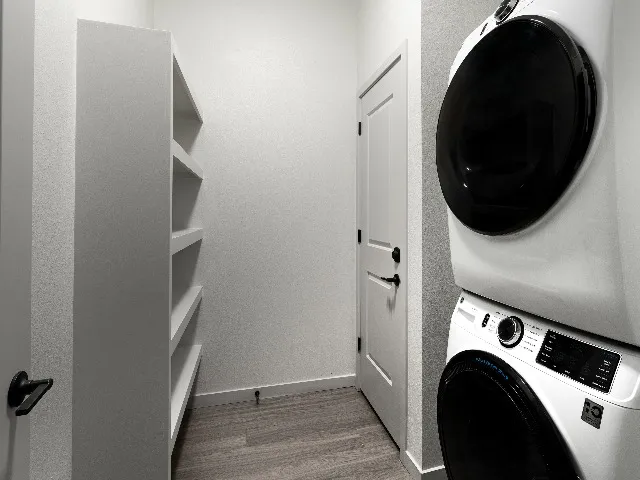 Laundry area with front-loading stackable washer and dryer
