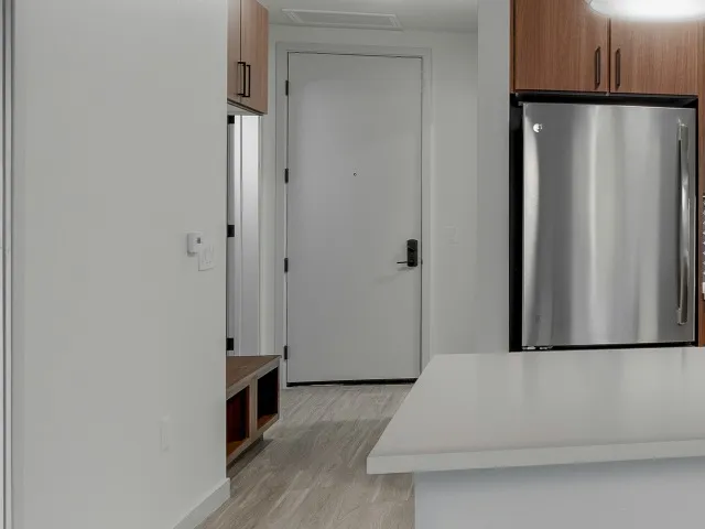 Urban mudroom storage area shown on the left near the entrance