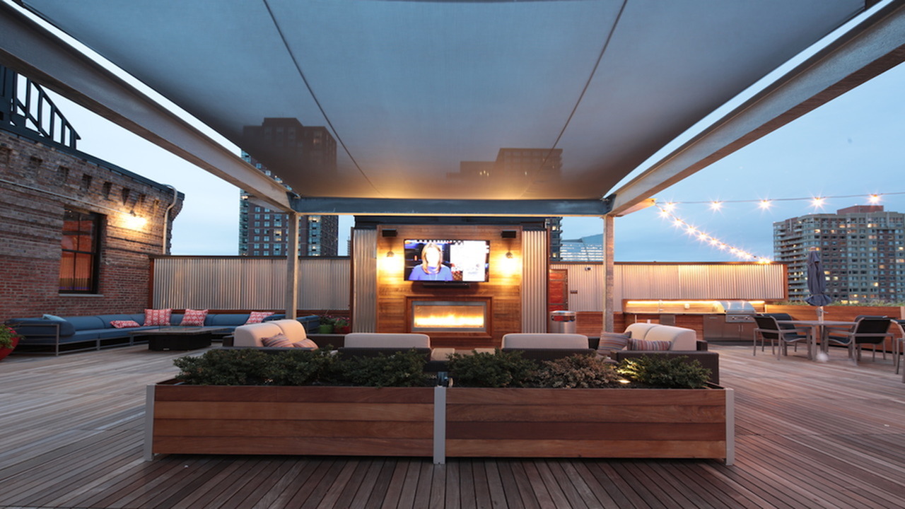 Roof Top Deck with Entertainment Seating around a Wall Mounted Television
