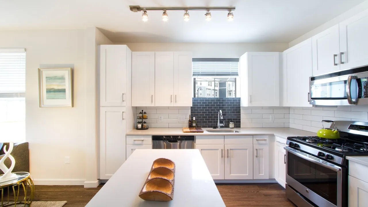 Modern Kitchen with Quartz Counters, Subway Tile and Stainless Appliances