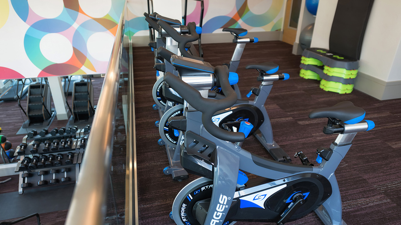 Spin Bikes on the Second Floor Overlooking the Fitness Studio