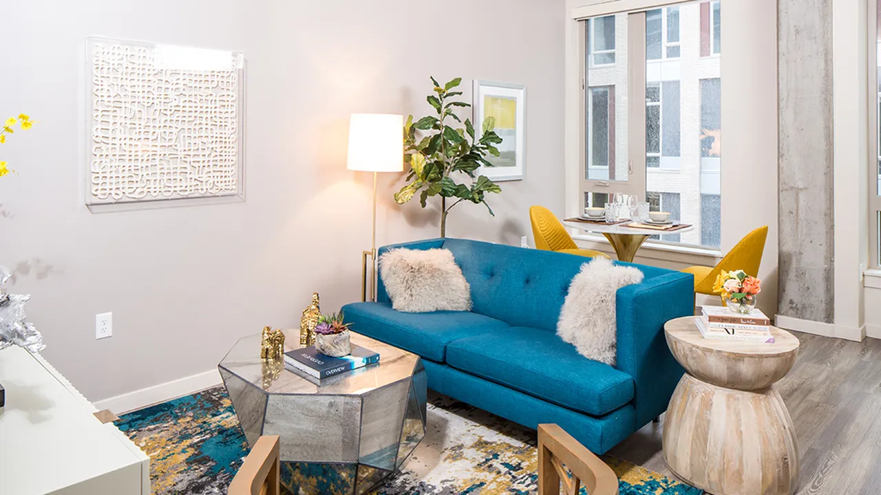 Furnished living area with expansive windows