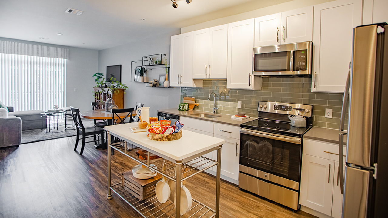 Kitchen with glass tile back splash
