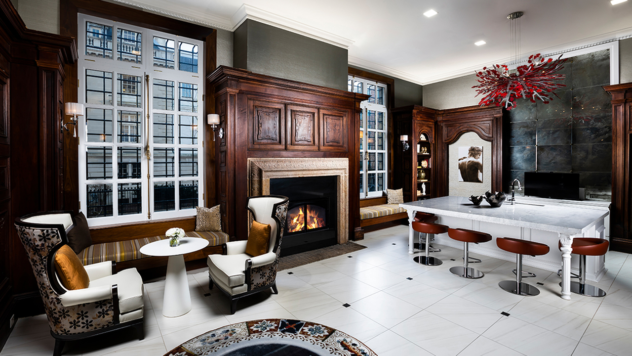 Preserved Historical Elements and Cabinetry in Grand Lounge area featuring a Fireplace