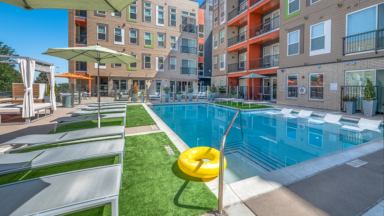 Refreshing swimming pool with relaxing poolside lounging
