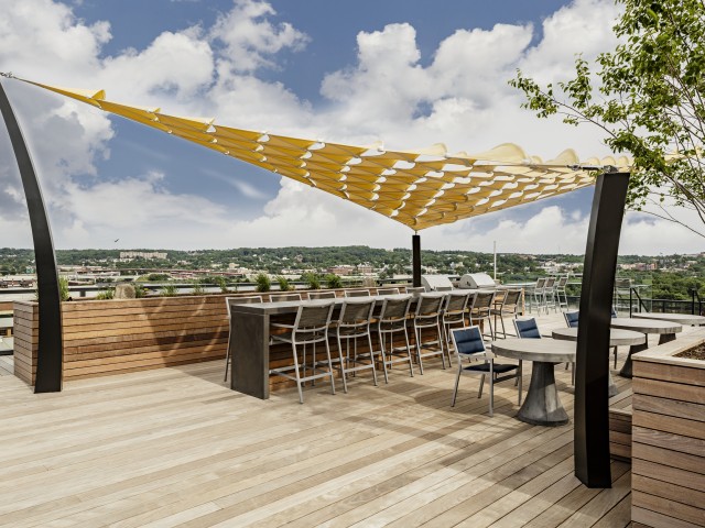 Fully-Appointed Rooftop Terrace with View of Trees and Waterway