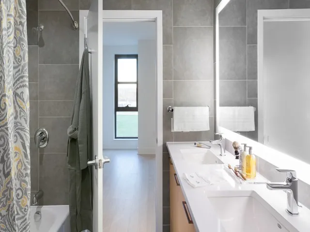 Tile Surround Large Master Bath Room with Dual Vanity and Back-Lit Mirror