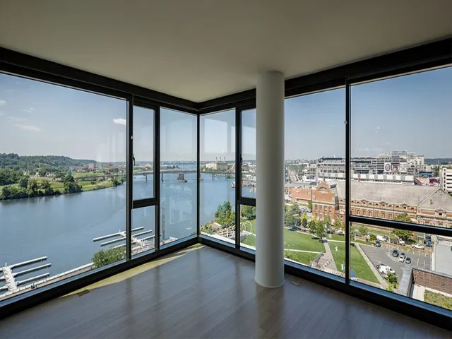 Floor to Ceiling Windows Overlooking the City and Waterway