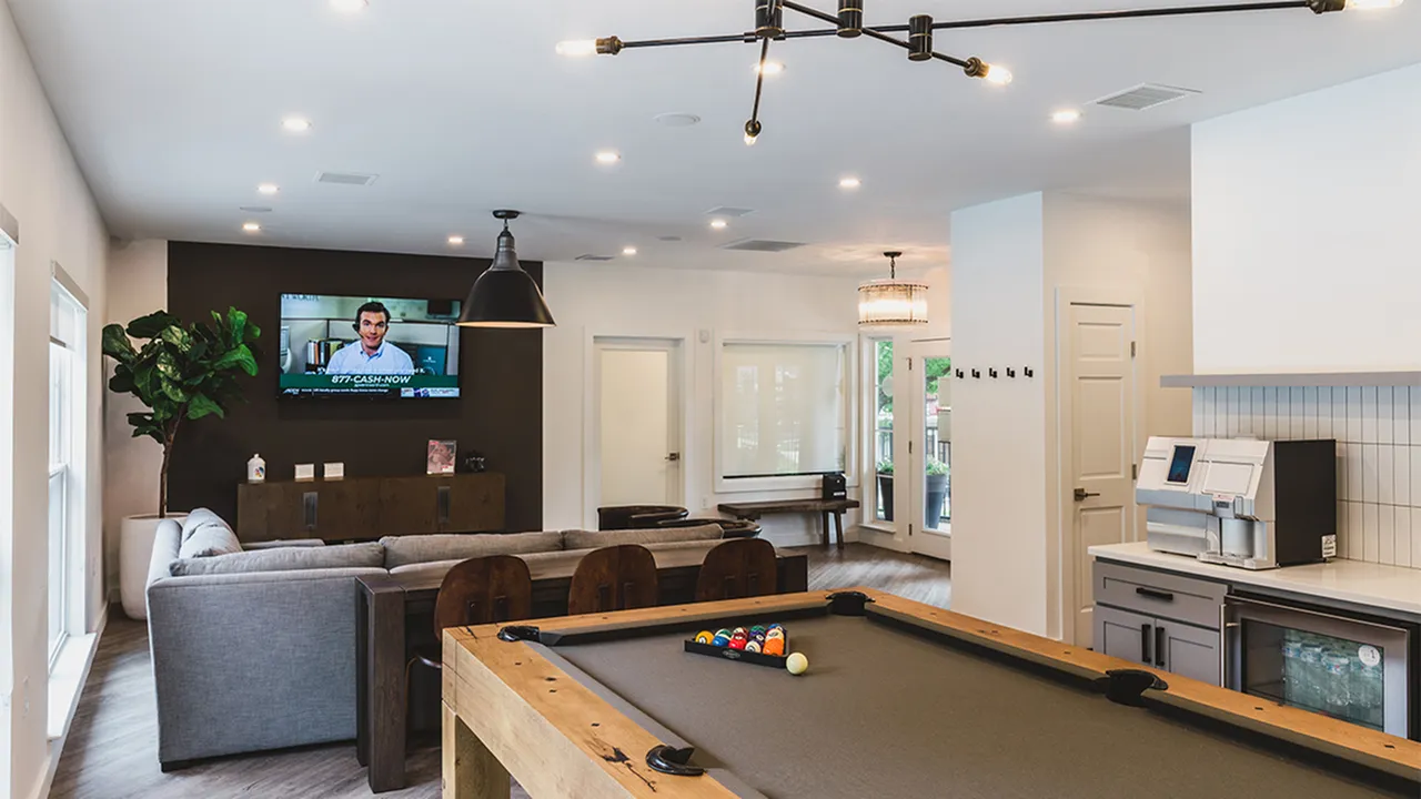 New clubroom with billiards table, lounge sofa, flatscreen TV and gourmet coffee machine