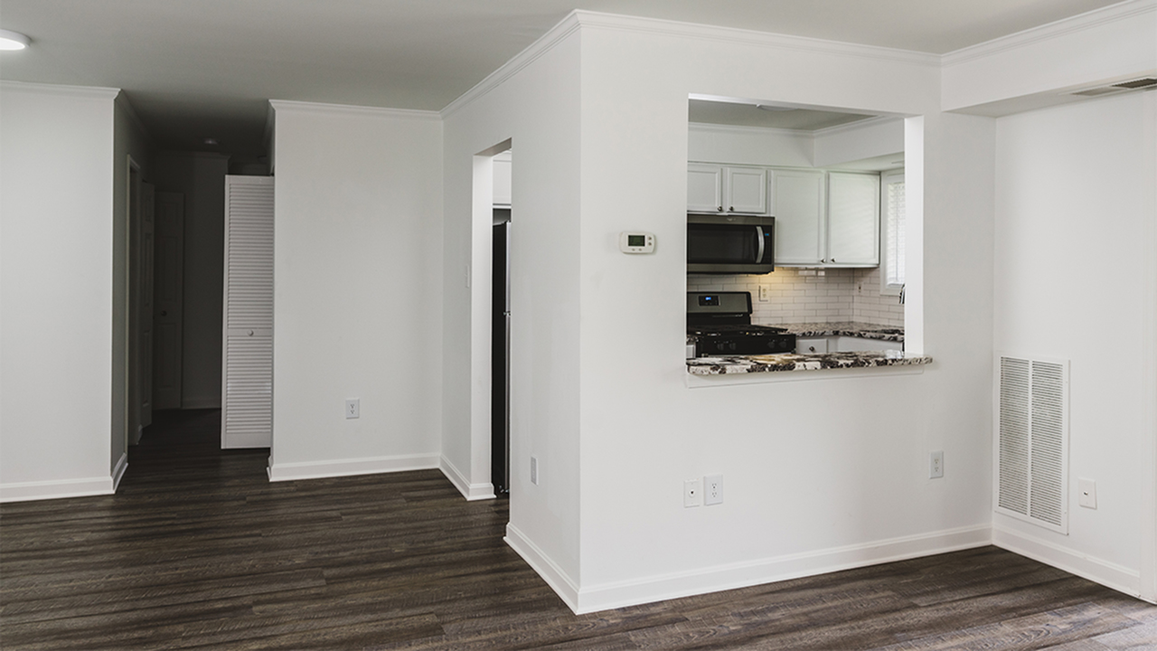 Upgraded home with breakfast bar peeking into kitchen