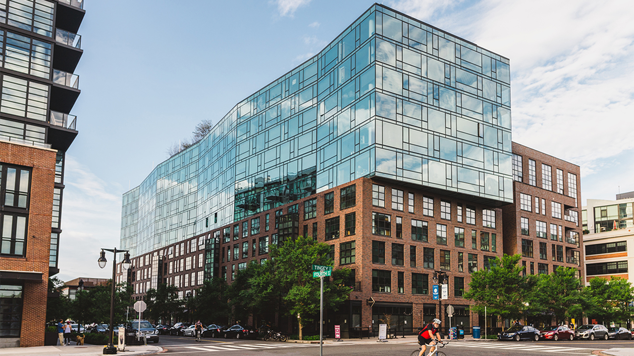 Glass and brick building on corner of Fourth and Tingey Streets
