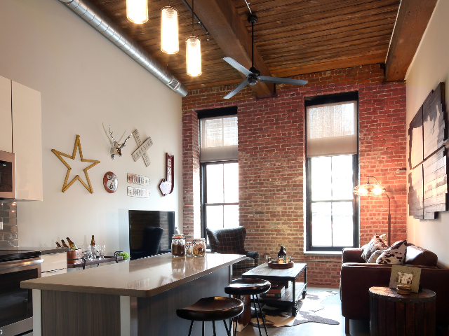 Furnished home with exposed brick work