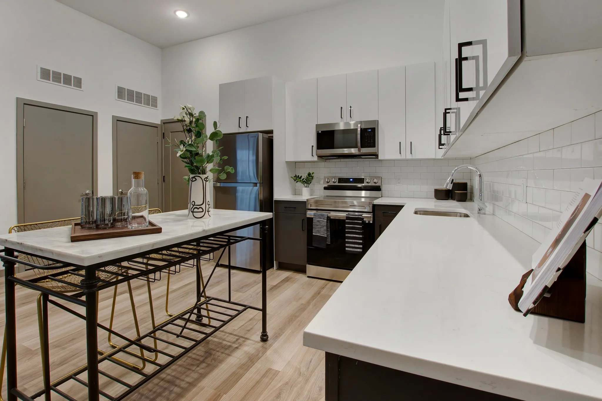high end cabinetry and tile backsplash in kitchens at modera berkeley heights apartments new jersey