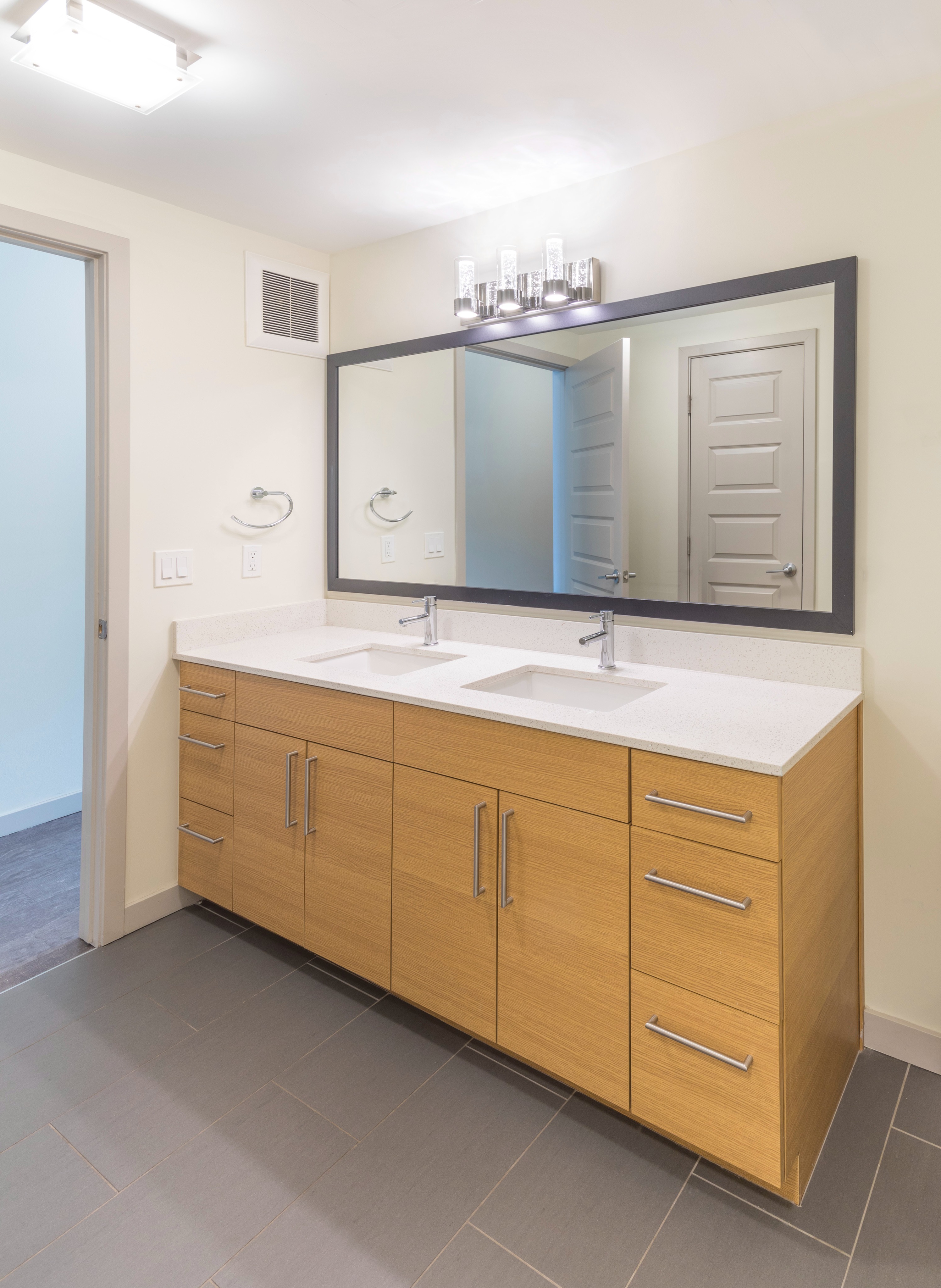 double-vanity bathroom at modera river north apartment homes for rent in denver colorado