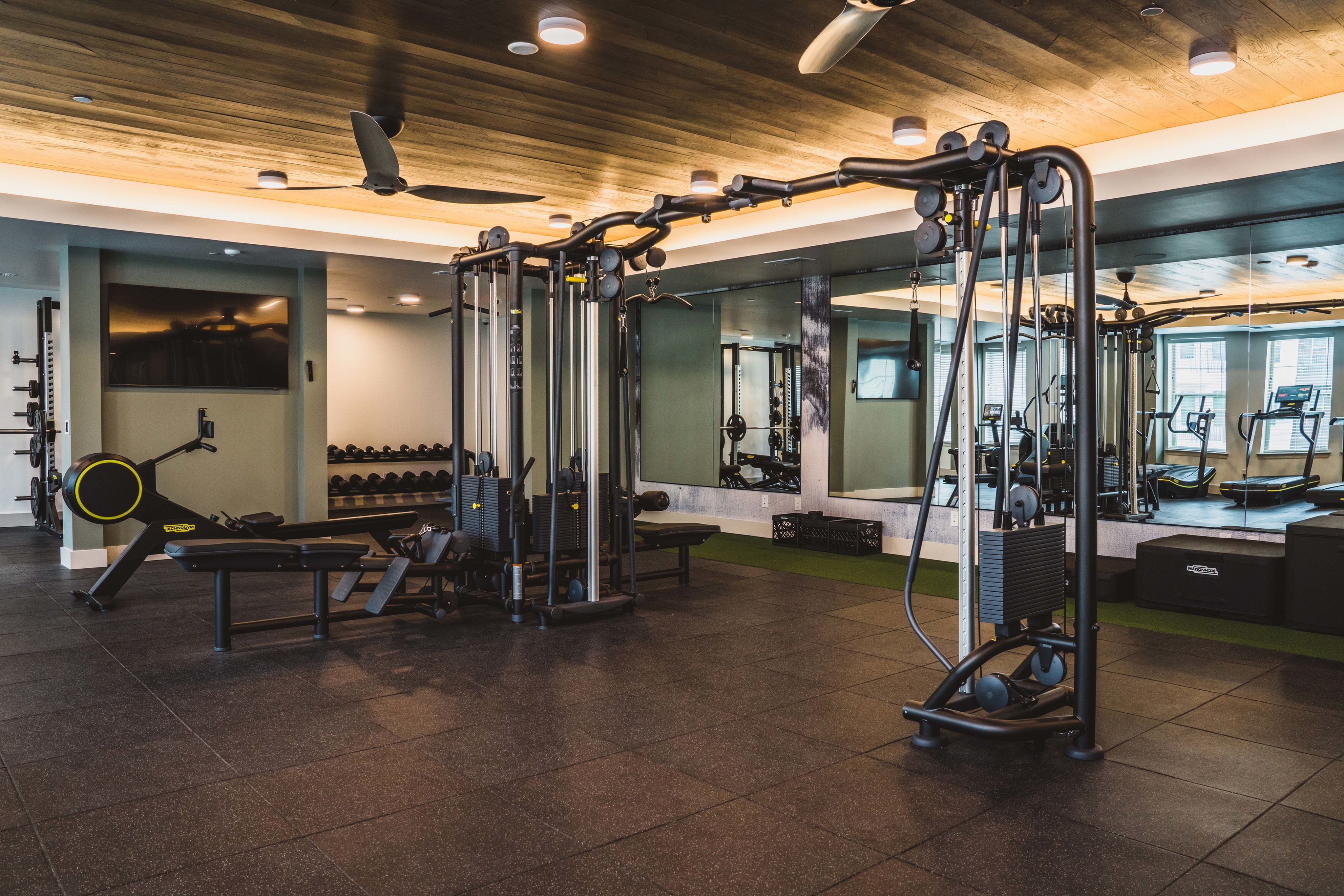 HIIT machine and free weights in state of the art on-site fitness center