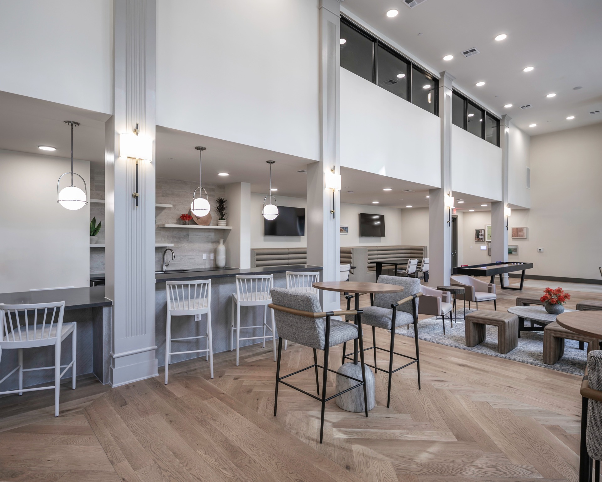 clubroom and bar area at modera six pines apartment homes for rent in texas